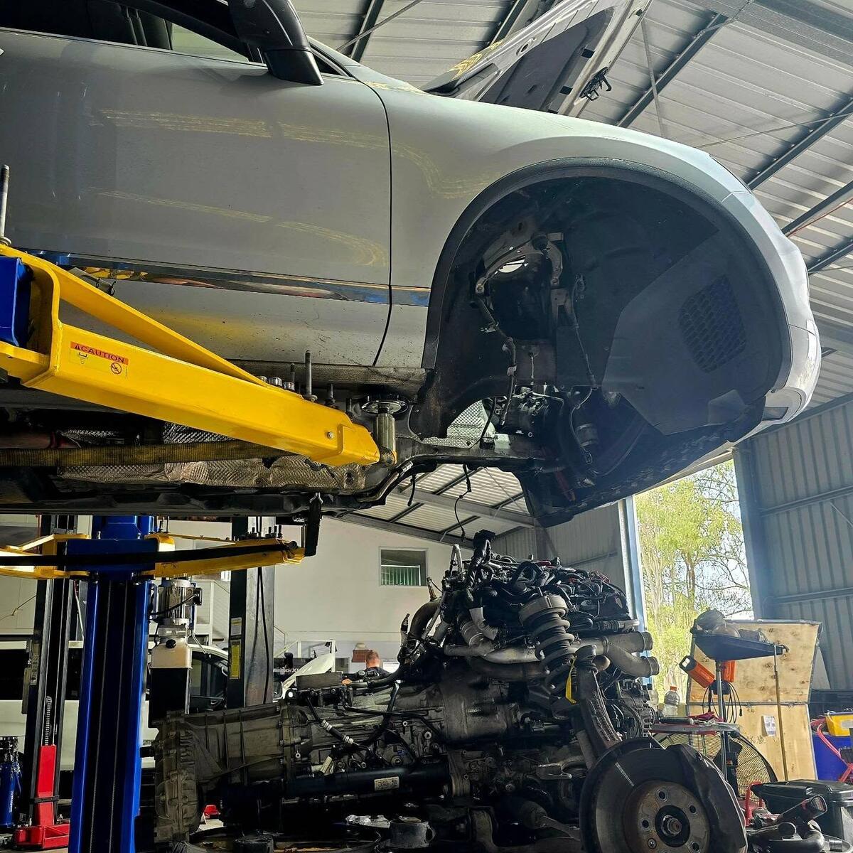 Vehicle raised on the hoist for underbody work